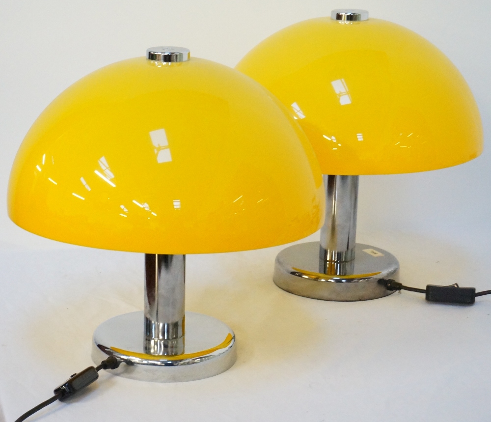 PAIR OF 1970's STYLE TABLE LAMPS with domed yellow plastic shades on polished steel bodies,