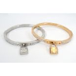 TWO CRYSTAL SET MICHAEL KORS BRACELETS with padlock detail,