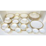 ROYAL DOULTON 'ROYAL GOLD' TEA/DINNER SERVICE comprising seven cups; ten saucers; eight side plates;