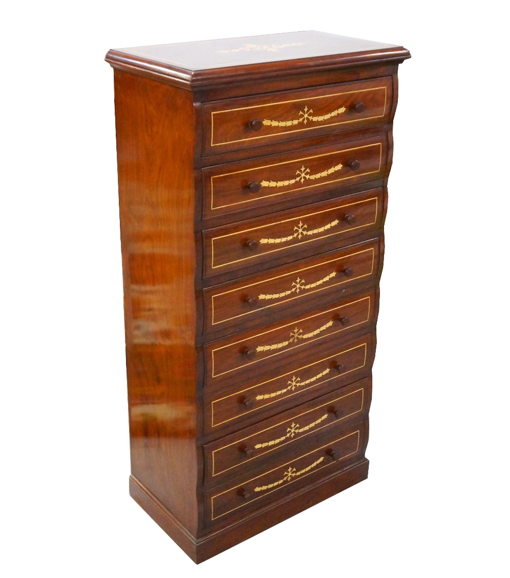 TEAK AND INLAID CHEST the moulded top above eight shaped drawers with turned handles,