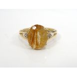 RUTILATED QUARTZ AND DIAMOND DRESS RING the central quartz flanked by three diamonds to each