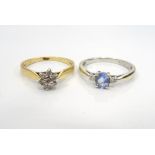 TANZANITE AND DIAMOND THREE STONE RING on nine carat gold shank,