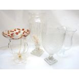 SELECTION OF GLASSWARE comprising a large shaped vase on a square stepped base,