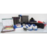 COLLECTION OF CELL ACCESSORIES including a pair of training shoes, anatomy books,