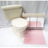 BATHROOM FURNITURE including cream ceramic toilet, a wall mounted cabinet with mirrored doors,