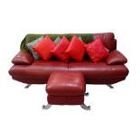 RED LEATHER TWO SEATER SETTEE raised on chrome feet, 214cm wide,
