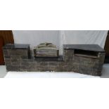 LARGE SIMULATED BRICK FIREPLACE with central recess containing log effect electric fire,