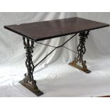OBLONG TOPPED PUB TABLE standing on shaped cast iron supports,