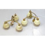 PAIR OF 1950's BRASS PENDANT LIGHTS each with three opaque glass shades with decorative floral