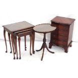 NEST OF THREE MAHOGANY TABLES with inset glass tops standing on cabriole supports,