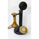 VINTAGE STICK TELEPHONE with brass mounts, raised on circular base, 32cm high,