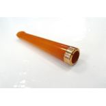 AMBER CHEROOT HOLDER with nine carat gold mount,