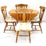 DROP FLAP CIRCULAR KITCHEN TABLE standing on a turned column with outswept supports,