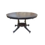 LATE VICTORIAN EBONISED LOO TABLE with an oval tilt top,