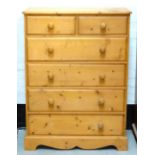 WAXED PINE CHEST with two short and four long drawers with turned handles,