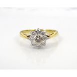 PRETTY DIAMOND CLUSTER RING on eighteen carat gold shank, the diamonds totalling approximately 0.