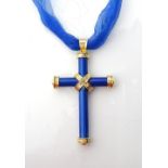 THEO FENNELL BLUE ENAMEL AND EIGHTEEN CARAT GOLD CROSS PENDANT the enamel cross with gold foliate