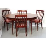 'GREAVES & THOMAS' MAHOGANY EXTENDING DINING TABLE with a pull apart top revealing a fold out leaf,