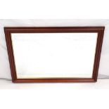 LARGE WALL MIRROR with a bevelled plate and stained frame, 102cm x 72.