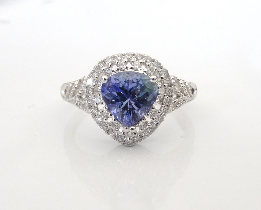 TANZANITE AND DIAMOND CLUSTER RING the trillion cut tanzanite approximately 1.