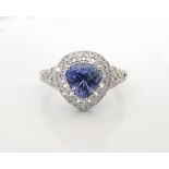 TANZANITE AND DIAMOND CLUSTER RING the trillion cut tanzanite approximately 1.