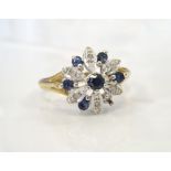 SAPPHIRE AND DIAMOND CLUSTER RING the setting of pierced flower head design,