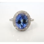 TANZANITE AND DIAMOND DRESS RING the large central oval cut tanzanite approximately 3.