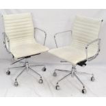 PAIR OF WHITE LEATHERETTE OFFICE ARM CHAIRS with chrome frames and ribbed bodies,