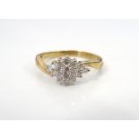 DIAMOND CLUSTER RING the diamonds in rhombus shaped setting totalling approximately 0.