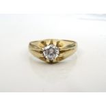 CLEAR GEM SET SOLITAIRE RING on nine carat gold shank,