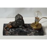 ART DECO STYLE TABLE LAMP with spelter lion in recumbent position,