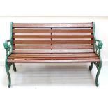 SLATTED GARDEN BENCH with shaped cast iron end supports,