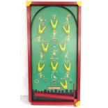 VINTAGE TABLE PIN FOOTBALL GAME with a green hardboard 'pitch' decorated with players and hoops for