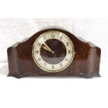 SHAPED WALNUT MANTLE CLOCK the circular dial with Arabic numerals,