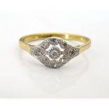 EDWARDIAN STYLE DIAMOND CLUSTER RING with pierced setting, on eighteen carat gold shank,