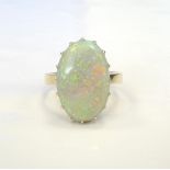 LARGE OPAL DRESS RING on nine carat gold shank,