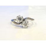 ATTRACTIVE DIAMOND TWO STONE TWIST DESIGN RING in eighteen carat white gold and platinum,