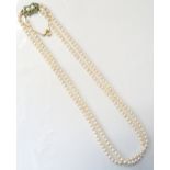 ATTRACTIVE DOUBLE STRAND CULTURED PEARL NECKLACE with turquoise and pearl set nine carat gold clasp,