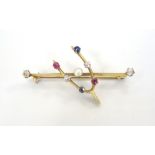 EDWARDIAN DIAMOND, RUBY, SAPPHIRE AND SEED PEARL WISH BONE BAR BROOCH in unmarked gold,