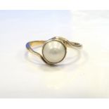 PEARL DRESS RING on fifteen carat gold shank with twist setting,