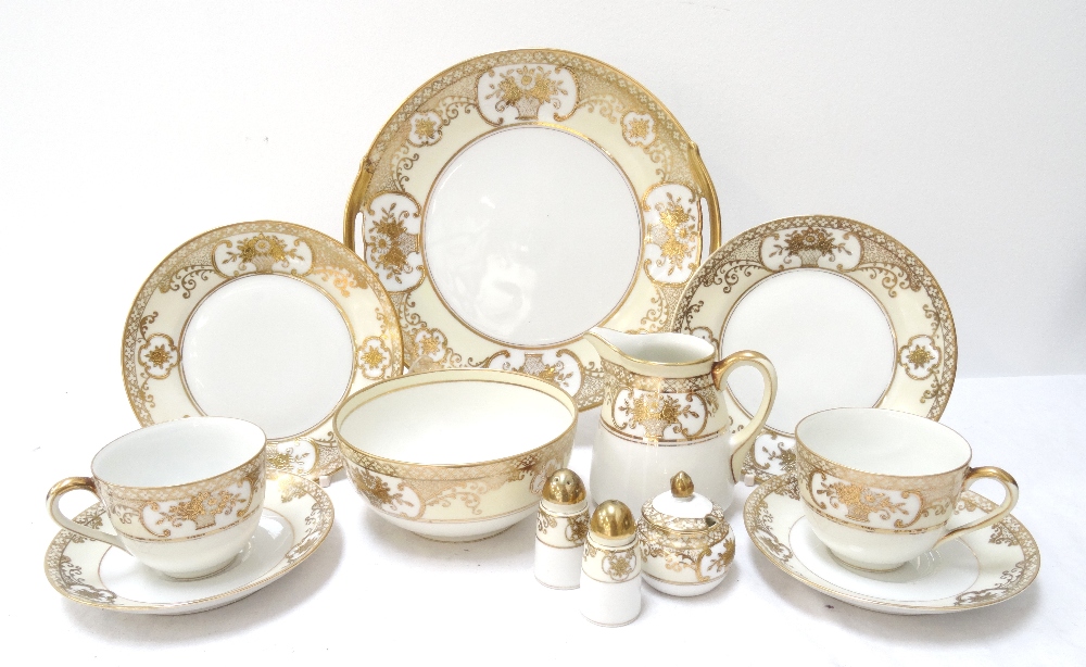 NORITAKE TEA SET decorated with gilt highlights over a yellow ground,