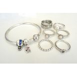 SELECTION OF PANDORA JEWELLERY including a silver charm bangle with two charms and five rings;