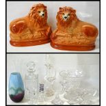 PAIR OF STAFFORDSHIRE POTTERY LIONS