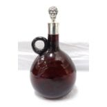 UNMARKED SILVER COLLARED AMBER GLASS DECANTER with associated unmarked silver stopper modelled as a