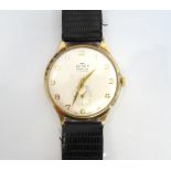 GENTLEMAN'S NINE CARAT GOLD CASED 'AUDAX' WRISTWATCH the champagne dial with Arabic numerals and