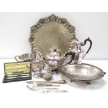 LOT OF SILVER PLATED WARES includes a three footed serving tray, cranberry glass bowl with stand,