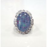 OPAL TRIPLET AND DIAMOND DRESS RING the large central opal in eighteen diamond surround,