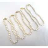 FIVE CULTURED PEARL BRACELETS all will pierced nine carat gold clasps (5)