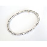 DIAMOND SET LINE BRACELET in eighteen carat white gold,