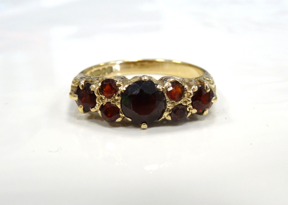 GARNET CLUSTER RING on nine carat gold shank,